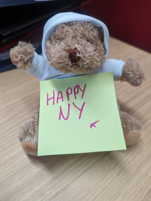 Birmsbie bear with Happy New Year post it note