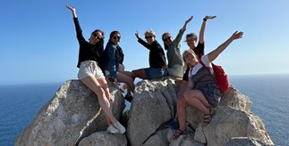 students on a rock