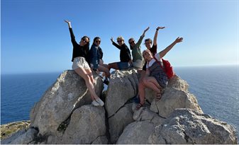 students on a rock