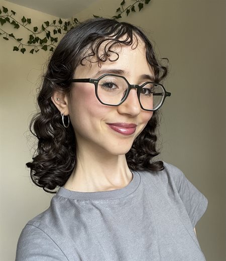 Hiba smiles in a headshot