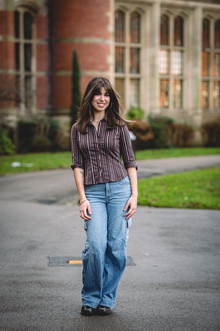 Student Content Shaper Natalie stands outside the Aston Webb building.