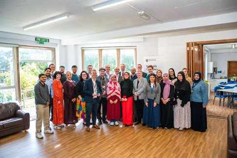 Group of staff and students and Aziz members together
